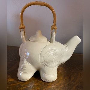 Cute Novica elephant teapot with rattan handle